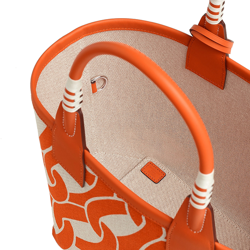 Hermes 24 new women's orange and white alternate canvas with leather stirrup handbag H084533CKAB